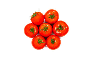 a pile of fresh red tomatoes on a white background top view
