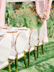 Table setting at a luxury wedding reception. Outdoor wedding