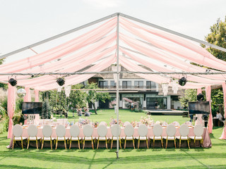 Table setting at a luxury wedding reception. Outdoor wedding