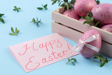 Easter. Pink Easter eggs in a box on a trendy blue background. Happy easter. holidays. close-up.