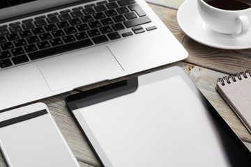 Open laptop with digital tablet and smartphone close up
