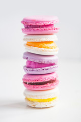 Macaroons dessert stack on white background