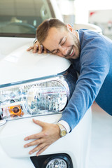 Handsome mature man buying a car