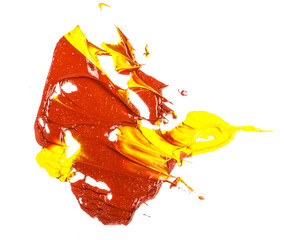 spot of yellow and red oil paint. smear on white background
