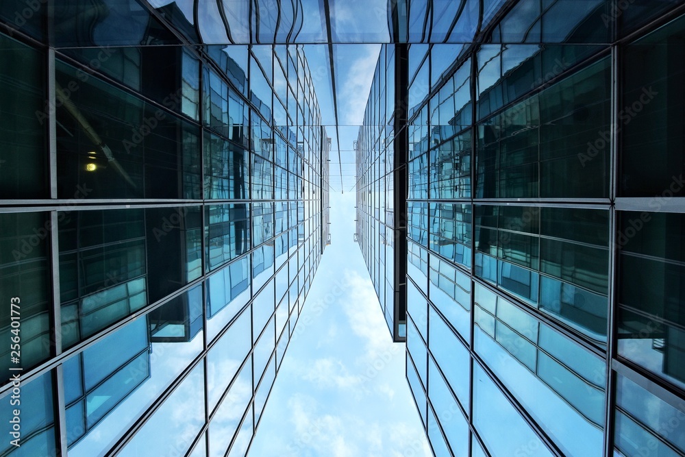 Wall mural Building facade with blue sky . Amazing perspective.