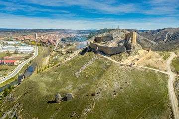 El Burgo de Osma medieval castle and town aerial view in Castille and Leon Spain with blue sky on a sunny day