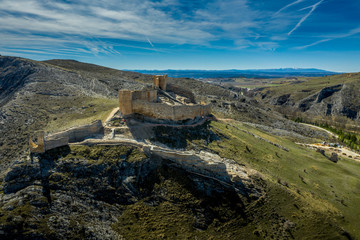 Fototapeta na wymiar El Burgo de Osma medieval castle and town aerial view in Castille and Leon Spain with blue sky on a sunny day