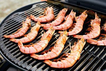 Grilled big tiger shrimps prawns on grill pan,
