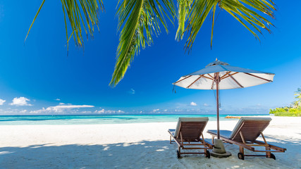 Maldives islands with blue sea water, pretty endless beach, soft white sands, luxury water villa, straight coconut trees, wonderful sunset sunrise scene. Luxury summer vacation concept