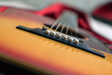 Close-up of an acoustic guitar lying in its case