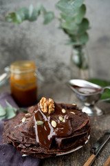 Chocolate pancakes with warm chocolate