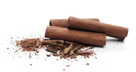 Cinnamon sticks with shavings isolated on white background