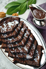 Chocolate pancakes with warm chocolate