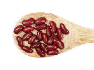 Raw red beans with wooden spoon isolated on white background 