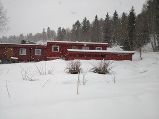 Wooden Norwegian buildings in the snow