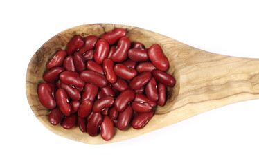 Raw red beans with wooden spoon isolated on white background 