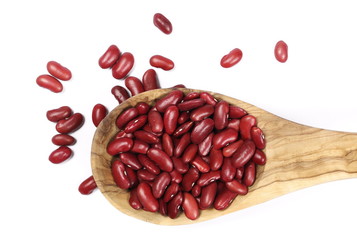 Raw red beans with wooden spoon isolated on white background 