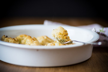 baked cauliflower with spices in ceramic form