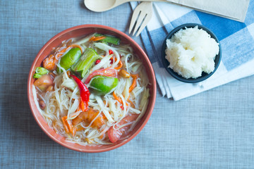 Spicy papaya salad mix with rice noodle (Som Tum)