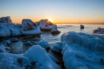 Sunrise by the sea in winter