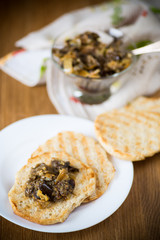appetizer of cooked eggplant with vegetables on bread