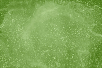 Green spring watercolor texture with abstract washes and brush strokes on the white paper background. Chaotic abstract organic design.