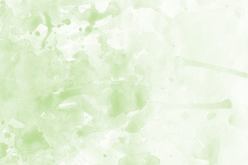 Green spring watercolor texture with abstract washes and brush strokes on the white paper background. Chaotic abstract organic design.