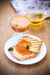 fried toast with apricot jam in a plate