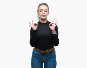 Young blonde woman wearing glasses over isolated background relax and smiling with eyes closed...
