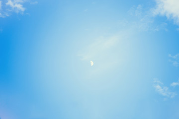 close up of The Moon in the Morning time with blue sky background.Growing moon. Horizontal photography