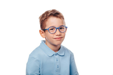 cucasian boy wearing eyeglasses and looking at camera over white background. Concept new eyeglasses for good vision