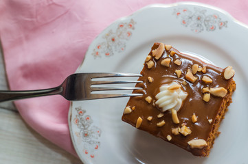 Fresh chocolate creamy cake with nuts