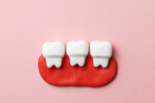 Healthy white teeth on pink background