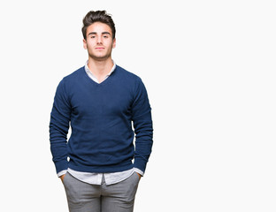 Fototapeta premium Young handsome business man over isolated background with serious expression on face. Simple and natural looking at the camera.