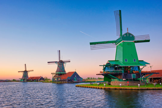 Windmills at Zaanse Schans in Holland on sunset. Zaandam, Netherlands