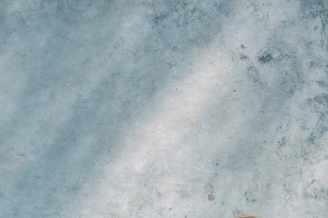 Obraz premium The texture of old white concrete. Sunlight and shadows on the wall.