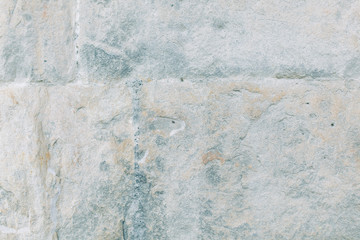 Texture of old masonry walls in Georgia. Sunlight and shadows from the leaves on the bricks.