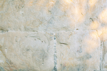 Texture of old masonry walls in Georgia. Sunlight and shadows from the leaves on the bricks.
