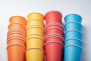 Multicolored eco paper party cups on white background