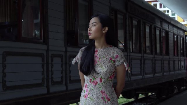 Vietnamese / South East Asian Girl Waiting At An Old Station In Da Lat, Vietnam