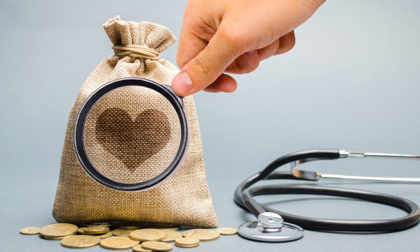 Money bag and heart image with stethoscope. The concept of medical insurance of life, family, health. Healthcare. The accumulation of money. Saving. Coins