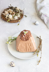 Chocolate Paskha (Pasha) with glaze. Traditional Russian orthodox Easter quark dessert. Easter food background. 