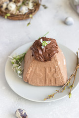 Chocolate Paskha (Pasha) with glaze. Traditional Russian orthodox Easter quark dessert. Easter food background. 
