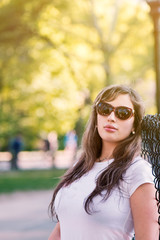 portrait of a youngbeautiful woman in the park exquisite divine stunning splendid outdoor tasty...