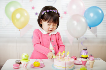 toddler girl celebrating her third birthday at home
