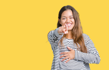 Young beautiful brunette woman wearing stripes sweater over isolated background Laughing of you, pointing to the camera with finger hand over chest, shame expression