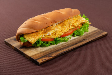 sandwich on wooden board