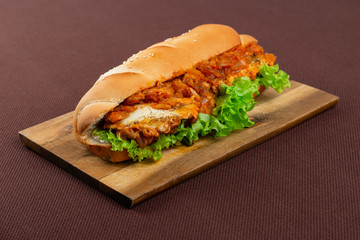 sandwich on wooden board