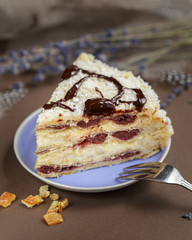 Delicious summer cherry cake on a purple plate