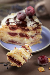 Delicious summer cherry cake on a purple plate